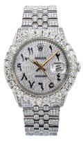 Rolex Datejust featuring a fully pavé-set dial, oversized diamond-style bezel, diamond-covered case and Jubilee bracelet, contrasted by black Arabic numeral markers and gold-tone hands.